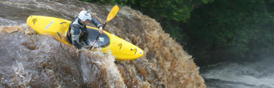 Canoeist going down Rainby Force, Park House Keld Canoeist going down Rainby Force, Park House Keld, Yorkshire